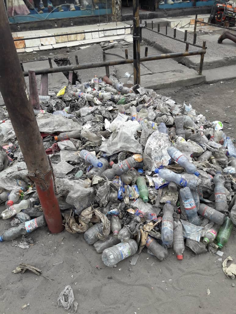 Plastic waste accumulations in the streets of Kinshasa