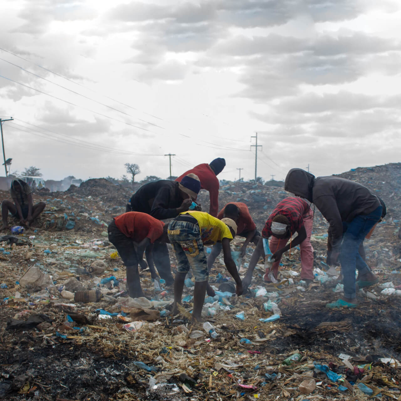 Young people picking waste from a dumpsite in Malawi